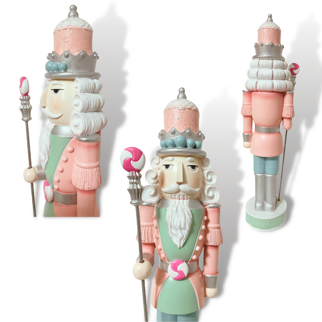 This 18" Resin Nutcracker exudes elegance and charm with its intricate detailing, delicate pastel hues, and distinctive peppermint accents on the belt buckle and staff.