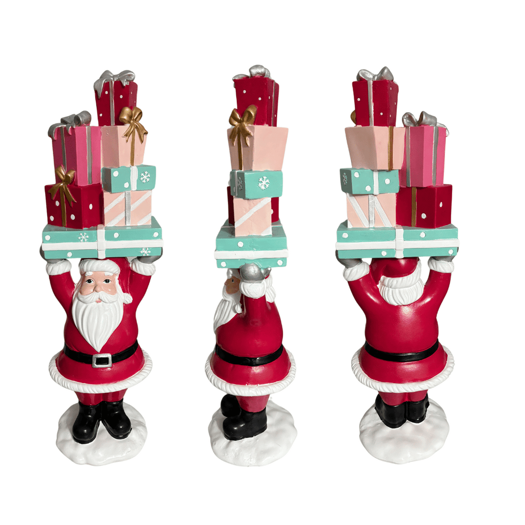Welcome your guests with this Fabulous holiday piece. &nbsp;This cheerful and bright hand painted Santa is the perfect greeter, holding a vibrant stack of presents that will bring joy to all. December Diamonds and Regency International Style Santa Greeter