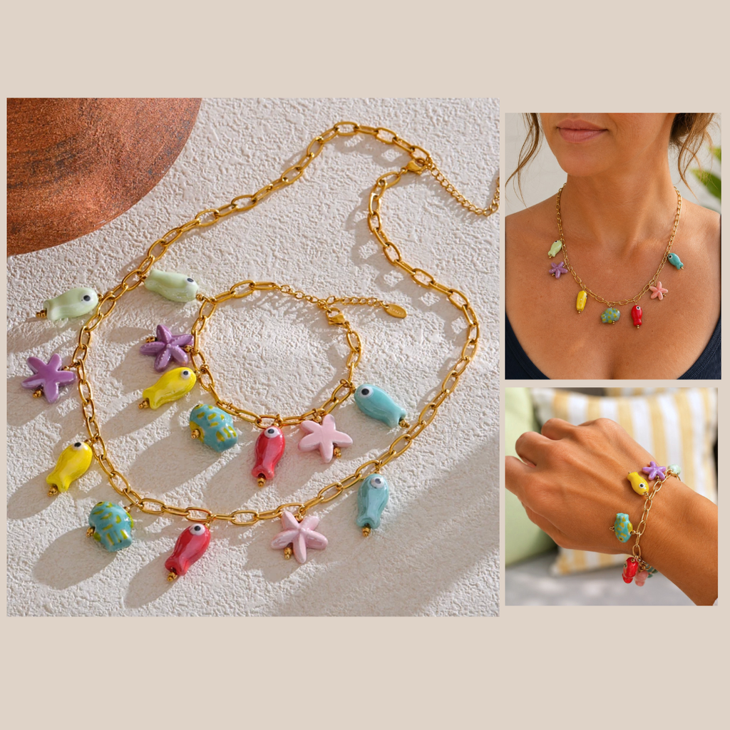 Colorful necklace with fish and starfish charms on a textured surface, worn by a person.