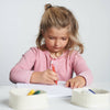 Eco Friendly Kids Art Supplies showing toddler drawing with safe art crayons