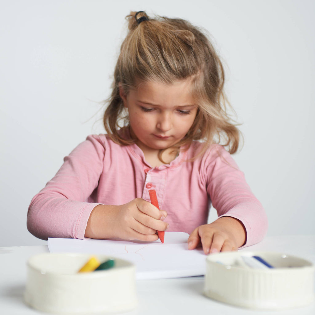 Eco Friendly Kids Art Supplies showing toddler drawing with safe art crayons