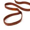 A brown velvet style dog leash with a small tan leather brand patch, shown on a clean white background.