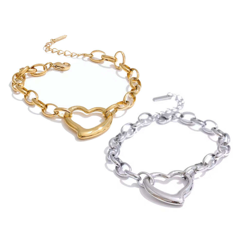 Gold and Platinum finish bracelet with bold heart charm centerpiece link