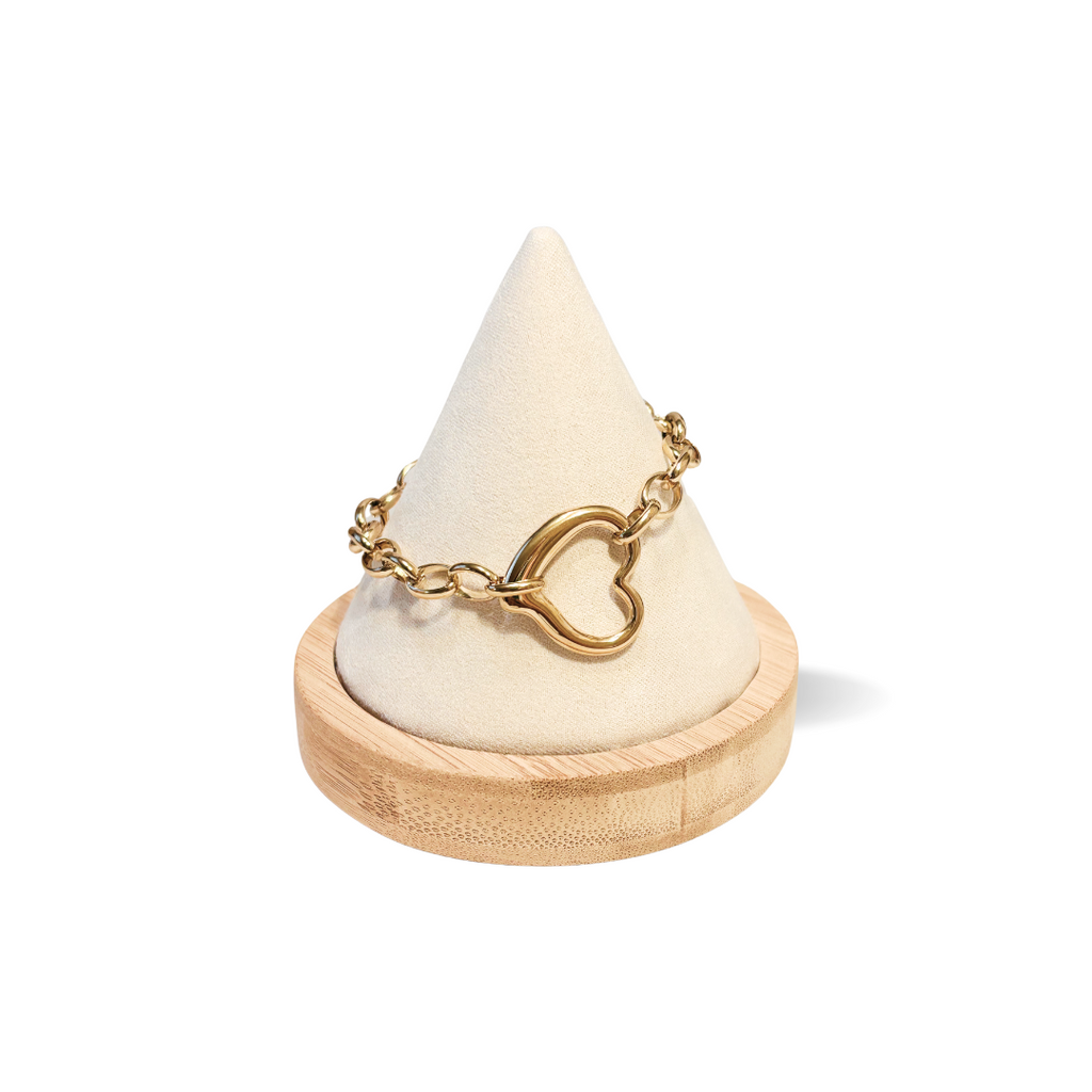 Gold chain ring on a wooden cone-shaped jewelry display