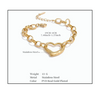 Gold chain bracelet approx 7.5 inches with heart-shaped links on a white background