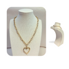 Closeup Gold heart drop chunky chain necklace on stand with back display