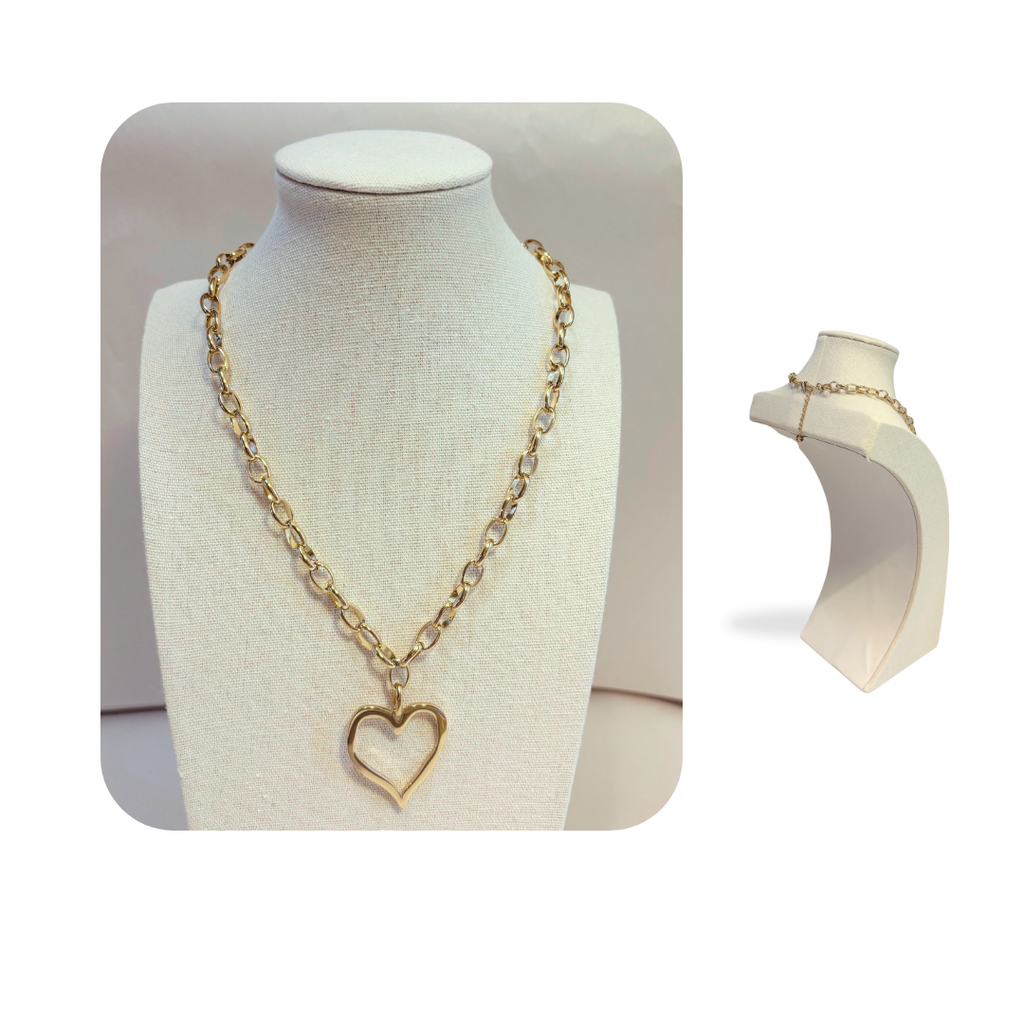 Closeup Gold heart drop chunky chain necklace on stand with back display