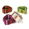 Sighthound Collars in brown, green, purple, and beige with rose gold buckles on a white background.