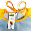 Yellow and blue children's art smock with a tag displaying brand information.