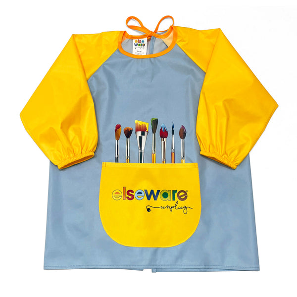 A children's long-sleeve paint smock with a light blue body, bright yellow sleeves and front pocket, and printed paintbrushes above the pocket. The front pocket has the 'elseware unplugged' logo.