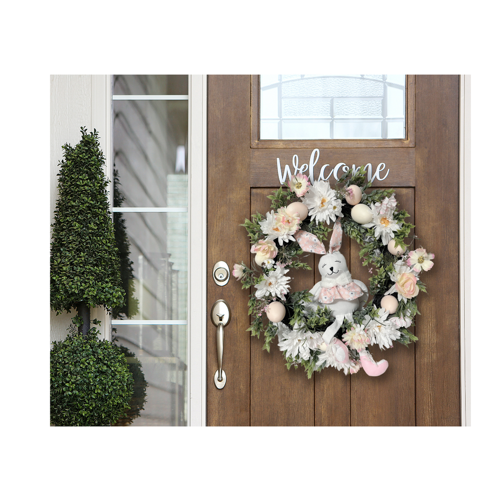 Easter floral and plush bunny wreath. This adorable Easter bunny front door wreath will welcome your family and friends in a sunshine way or add some charm to your spring wall decor. This spring flower wreath features a sweet Easter bunny girl with dangling legs sitting among flowers, greenery, and easter eggs.