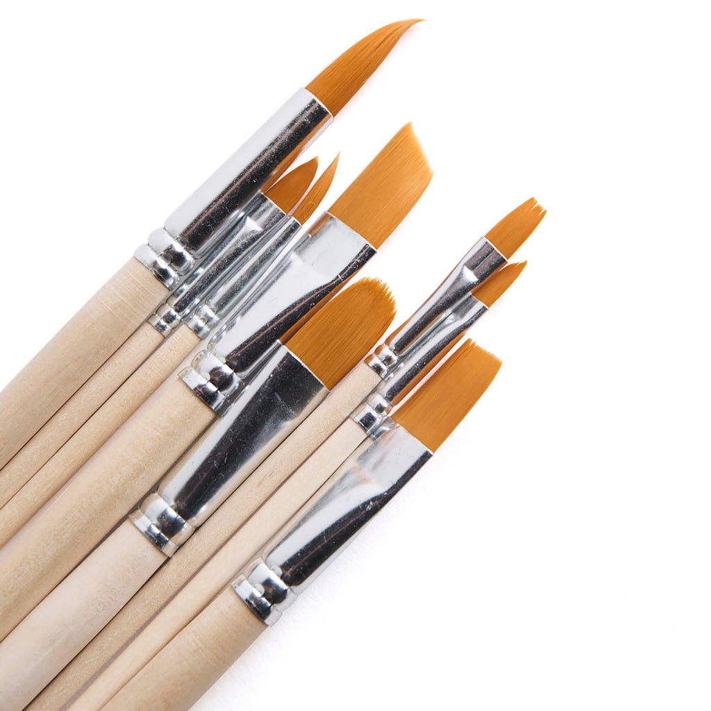 Set of paintbrushes with wooden handles and orange bristles on a white background