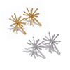 Gold and silver starburst earrings on a white background