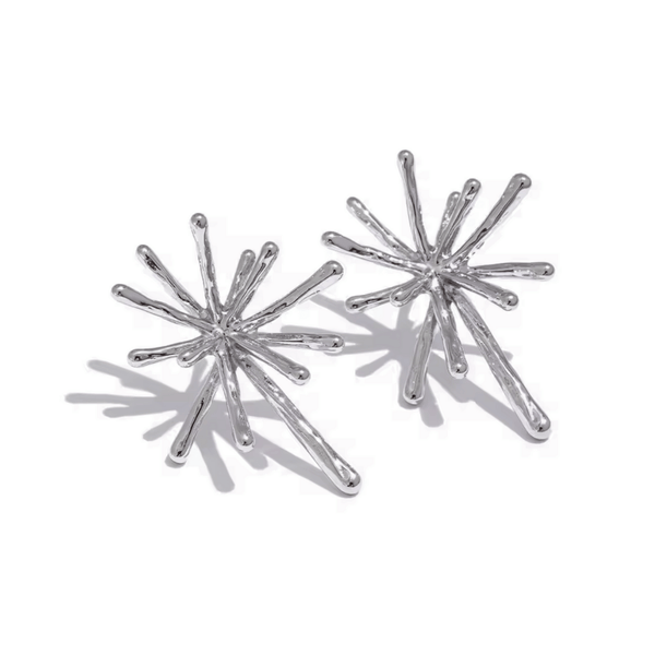 Silver starburst earrings on a white background