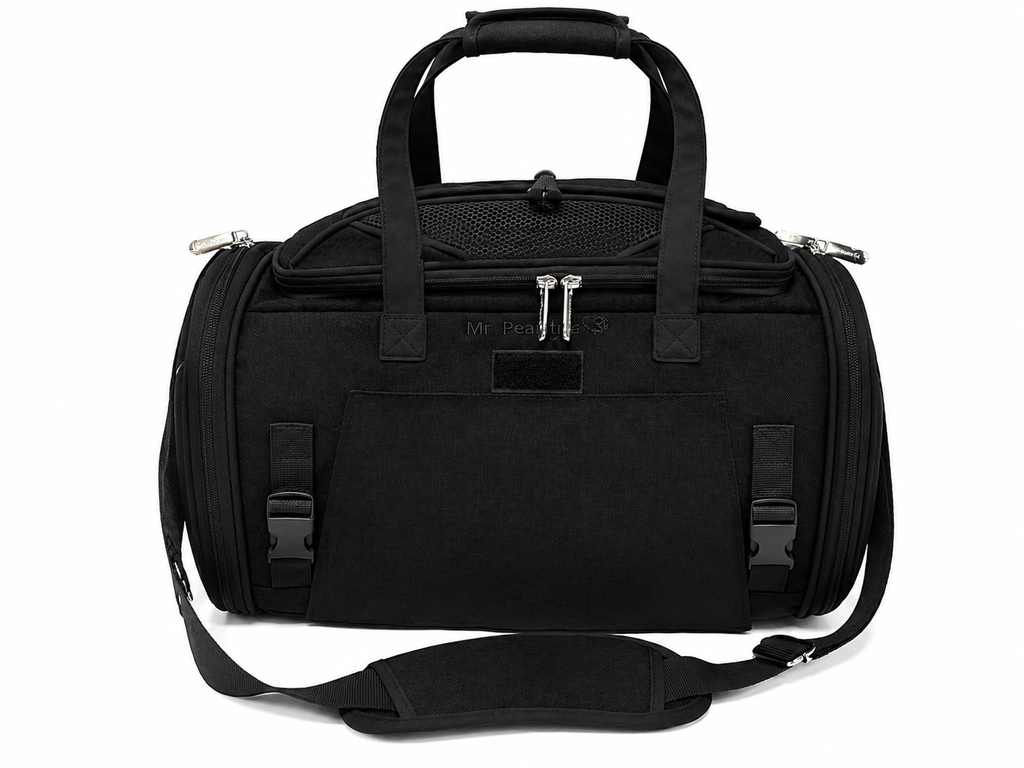 A black duffel bag with dual top handles, a detachable shoulder strap, and silver zipper pulls, shown on a plain white background.