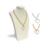 Gold heart drop pendant necklace on stand showing silver or gold color options.