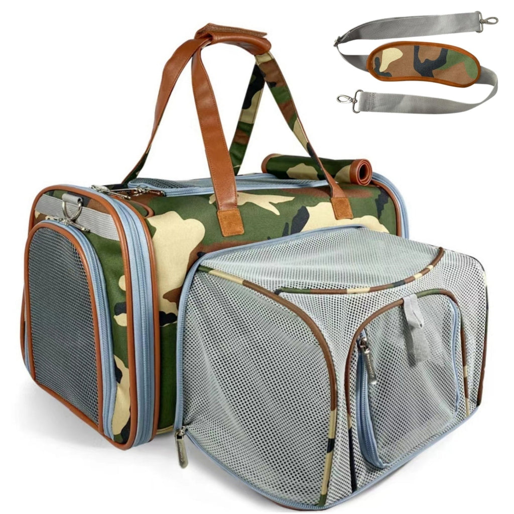 A camouflage pet carrier duffel bag with brown faux-leather handles and a light blue-gray mesh side pocket, shown on a white background with an inset showing the detachable shoulder strap.
