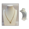 Gold puffy heart paperclip and chain necklace longer style on a mannequin bust with a plain background