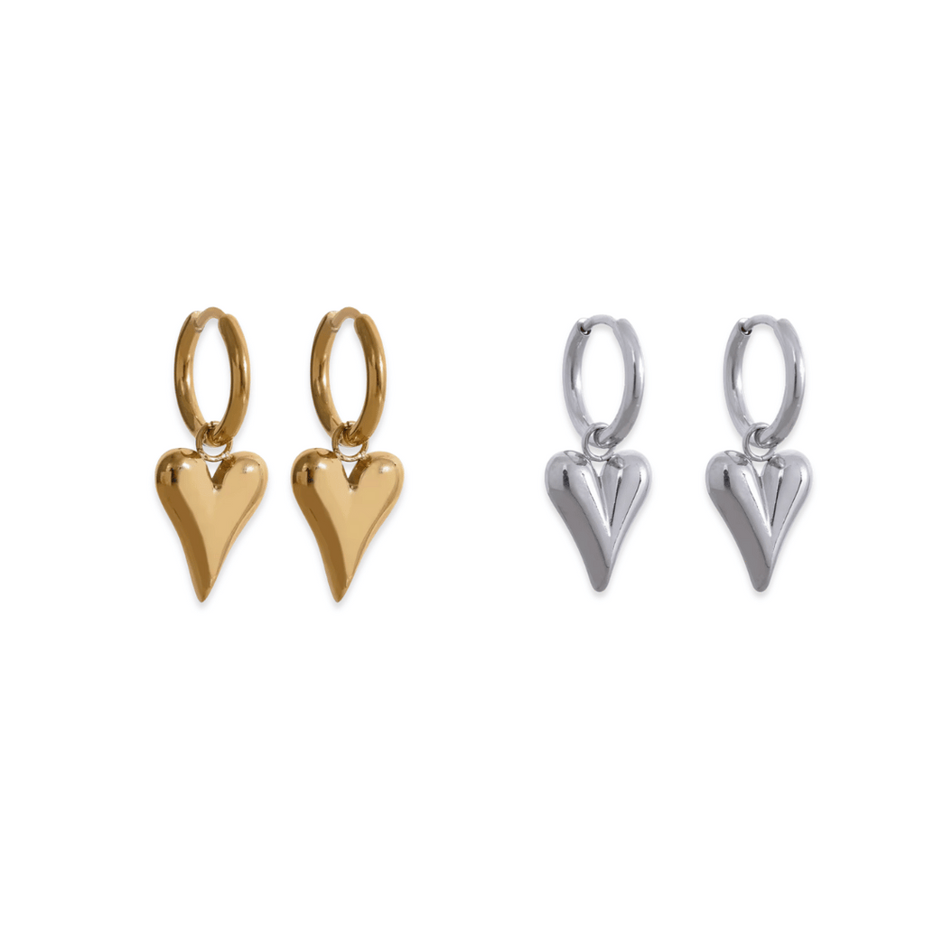 Gold and silver heart-shaped earrings on a white background