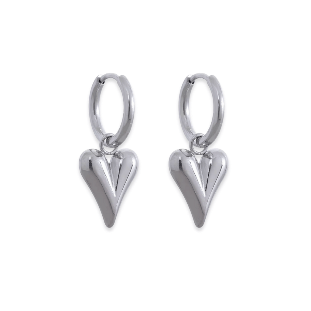 Silver heart-shaped earrings on a white background