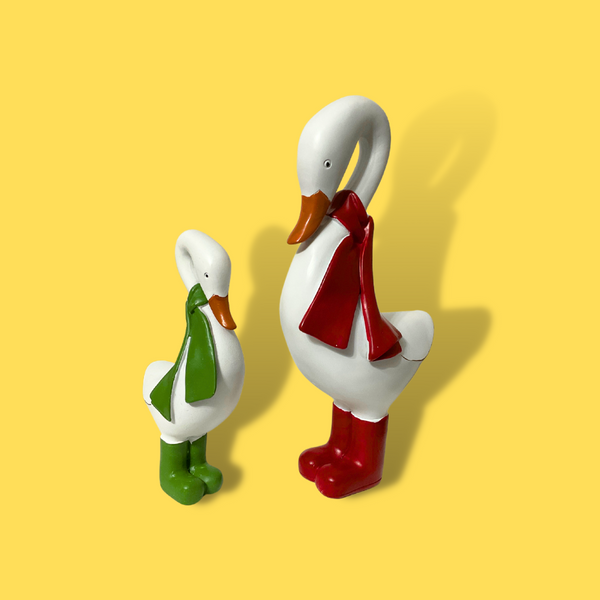 <p>Experience the joy and charm of the holiday season with our set of 2 hand-painted resin holiday ducks! These adorable ducks are dressed in festive red and green scarfs and matching boots. With one large and one smaller duck, this cute set is the perfect addition to your holiday decor.</p> <p>&nbsp;</p>
