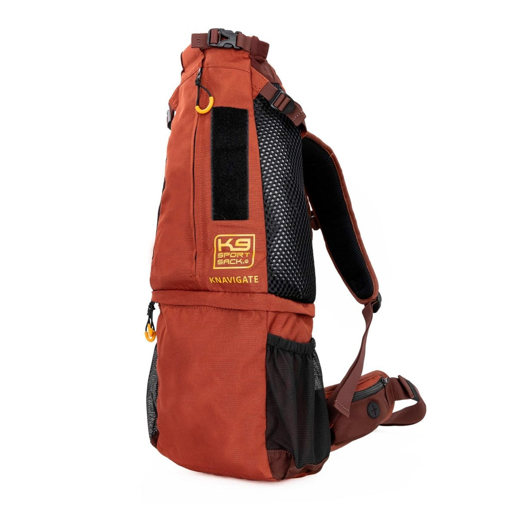 Orange backpack with black mesh section on a white background