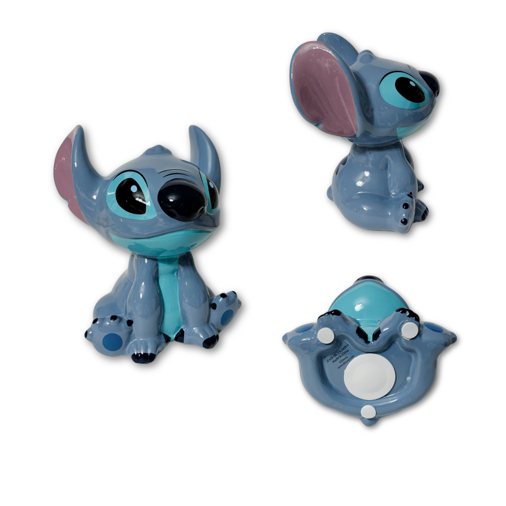 This delightful Stitch Piggy Bank is a must-have for any Lilo and Stitch fan! Made from sturdy resin, it measures 5"L x 4.5"W x 8"H - simply fabulous!&nbsp;&nbsp;