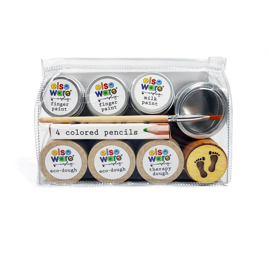 Set of art supplies including colored pencils, paint pots, and dough for eco friendly play and travel.