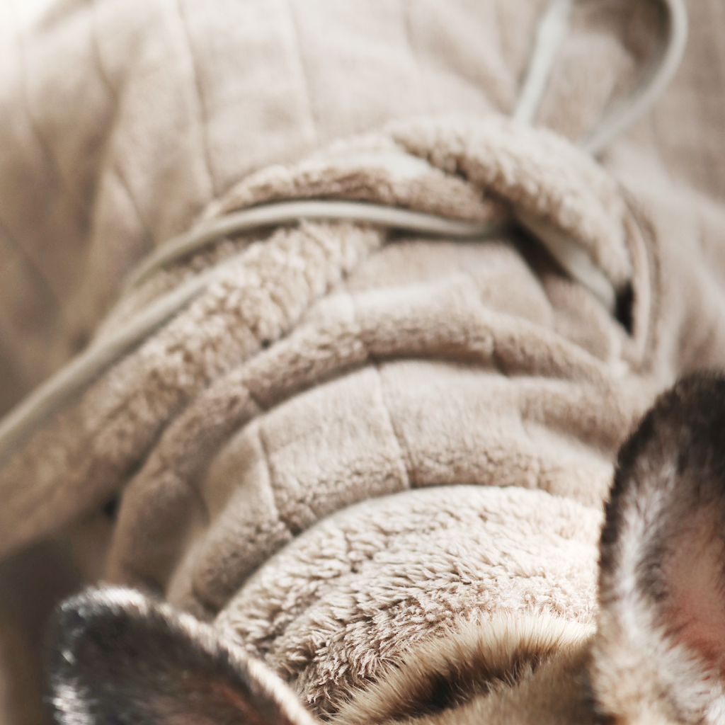 Close-up of a textured beige fabric surface