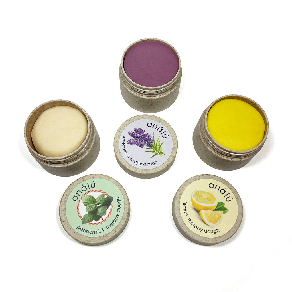 Set of 3 small containers with lids, each labeled with a different color and flavor of therapy dough.