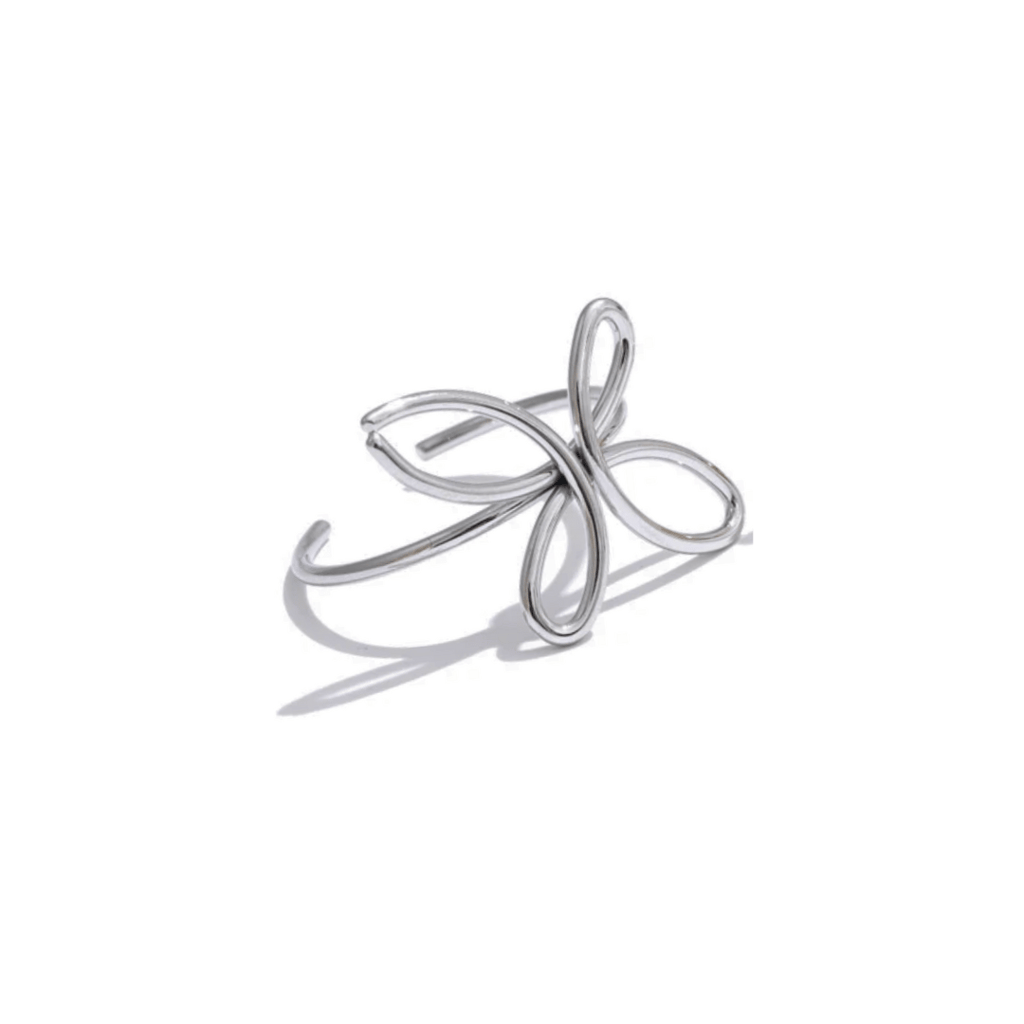 Silver ring with a flower butterfly design on a white background
