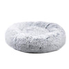 Fluffy gray donut pet bed on a white background