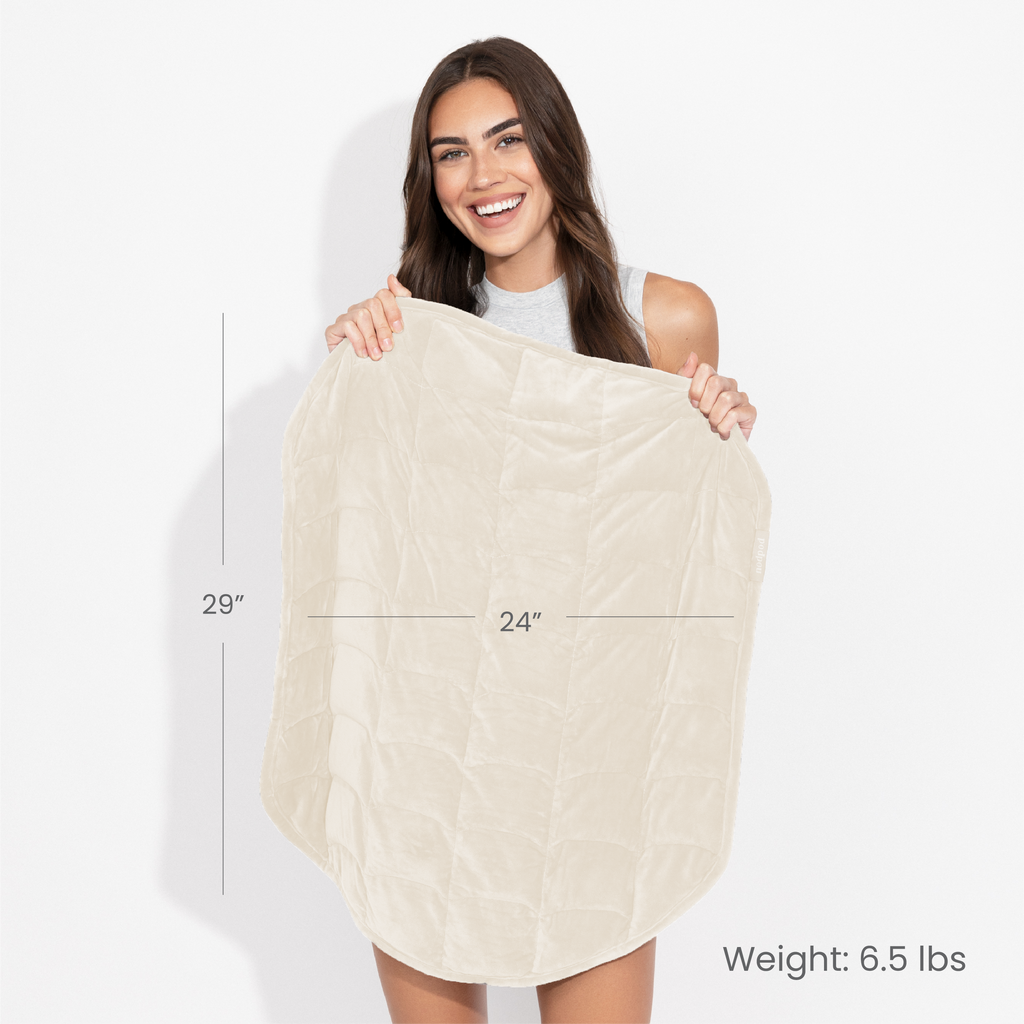 Woman holding a beige blanket with measurements and weight information on a white background