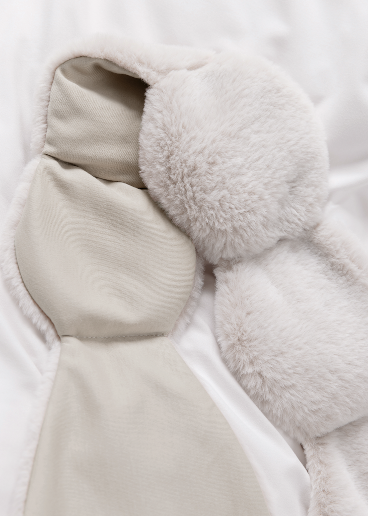 Closeup of faux fur white weighted eye mask