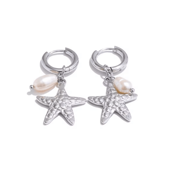 Pair of silver hoop earrings with starfish and pearl charms on a white background