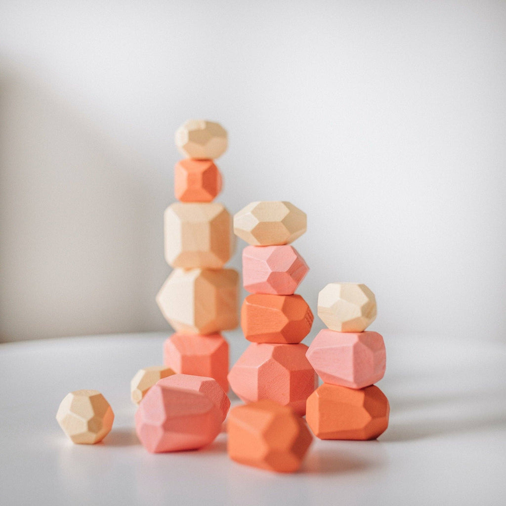 Stackable eco-friendly wooden stones to promote creativity and imagination. 