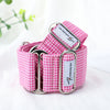 Pink checkered dog collar with metal buckle on a white background