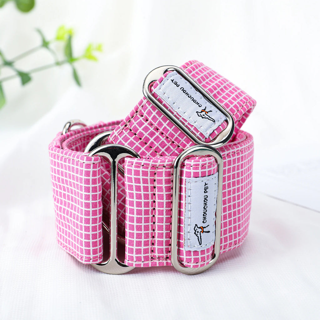 Pink checkered dog collar with metal buckle on a white background