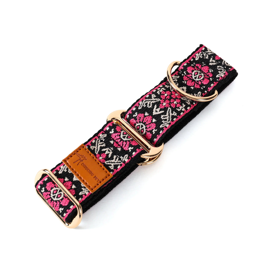 Dog collar with floral pattern and gold buckle on a white background