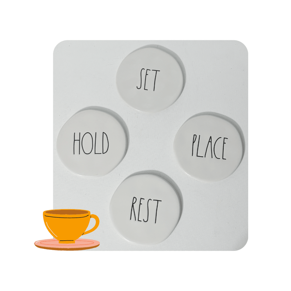 Rae Dunn Ceramic Coasters Stoneware CoastersEnhance your drink experience with these ceramic coasters featuring beautifully engraved words "Rest", "Place", "Set", and "Hold" in charming Rae Dunn artisan lettering. Each coaster measures 3.75" in diameter, adding a touch of elegance to your coffee mugs or any other beverage. Don't settle for ordinary coasters, elevate your home decor with this lovely set.