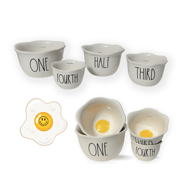 Add a playful touch to your morning routine with these charming new Rae Dunn Egg Measuring cups. Featuring a bright and sunny interior and whimsical Rae Dunn artisan script displaying One, Half, Third, and Fourth