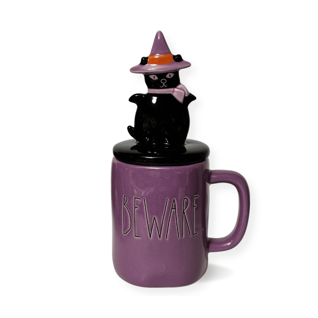 Beware Halloween Cat Mug;Add some spooktacular charm to your Halloween display with this delightfully whimsical Rae Dunn Beware mug, complete with a charming feline donning a witch's hat and scarf. Perfect for cat enthusiasts and witchy ones alike. Stands at 9.25"Tall - makes a fantastic decorative accent or present