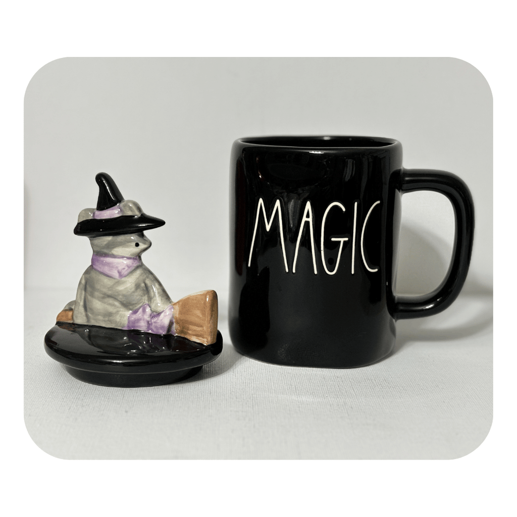 Rae Dunn Magic Coffee Mug; Rae Dunn Halloween Coffee MugCute Gift Ideas; Cute Cat Lover Gifts;Add some spooktacular charm to your Halloween display with this delightfully whimsical Rae Dunn Magic mug, complete with a witchy grey cat. &nbsp; Perfect for cat enthusiasts and witchy ones alike. Stands at 8.5"Tall - makes a fantastic decorative accent or present.