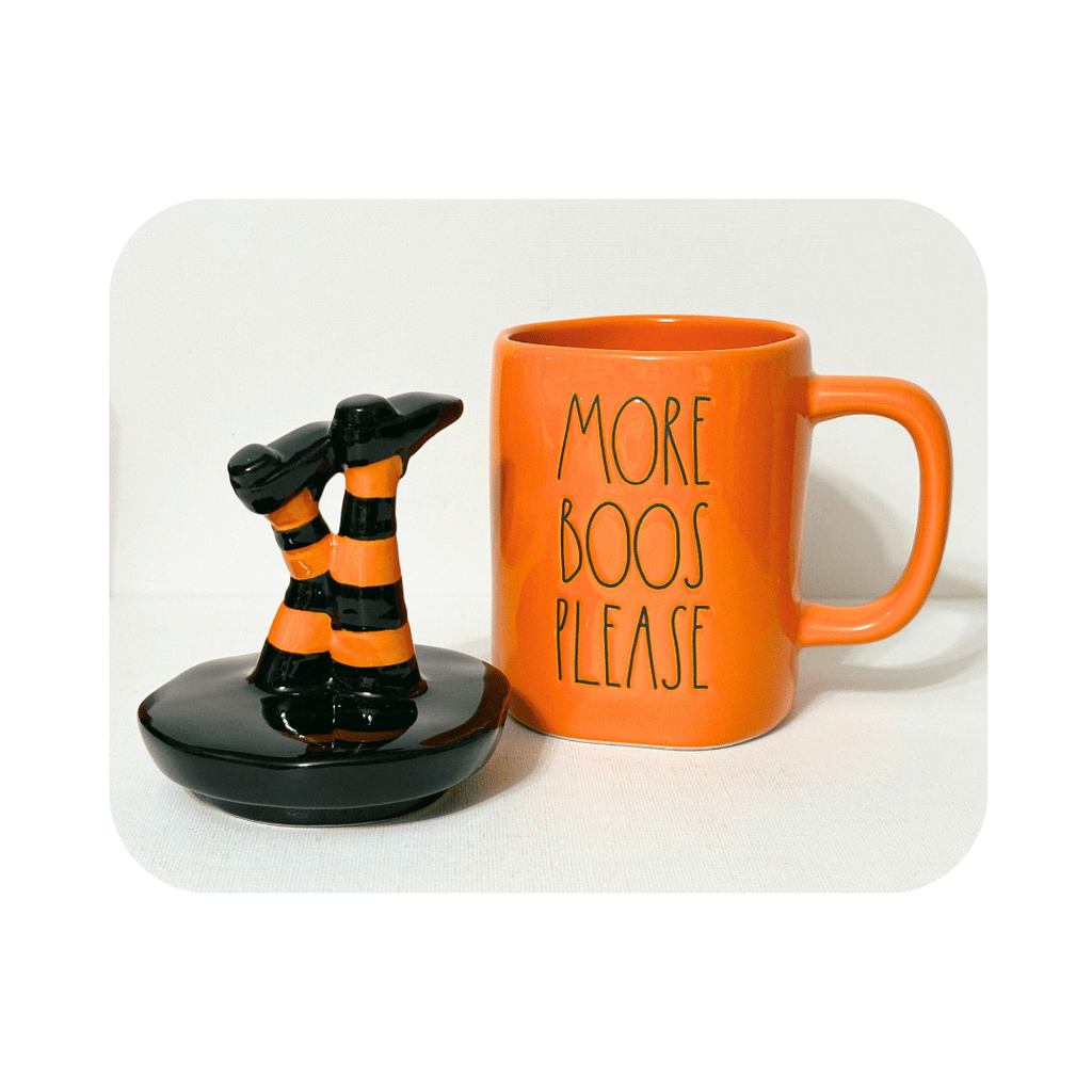 Get ready to spook up some laughs this Halloween with Rae Dunn's witchy More Boos Please mug. Featuring upside down witch legs and iconic artisan lettering, this orange mug is perfect for adding a touch of humor to your decor. It also makes a great gift for any ghouly girl who loves witches, or as a playful hostess gift. More boos, please! Cute Halloween Gifts