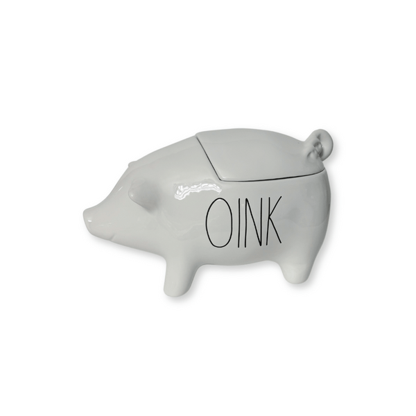 Rae Dunn Oink CanisterGet ready to squeal with delight over the "Oink" canister! As a must-have for any Rae Dunn fan, this large pig-shaped canister is truly iconic. Measuring 10"L, it features the classic Rae Dunn writing "Oink" and is made of sturdy stoneware. With engraved lettering and measurements of 10"L x 5.25"W x 5.5"H, this canister brings farmhouse charm to any contemporary kitchen.
