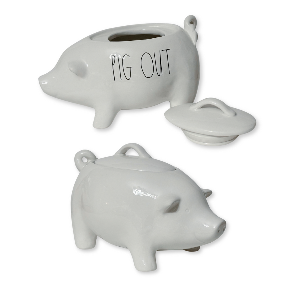 Indulge in your love for Rae Dunn with the addition of a Pig Out canister! This iconic, 10"L pig-shaped canister boasts the classic artisan lettering with a new phrase "Pig Out" and is crafted from durable stoneware. Bring a touch of farmhouse charm to your modern kitchen with this must-have piece.
