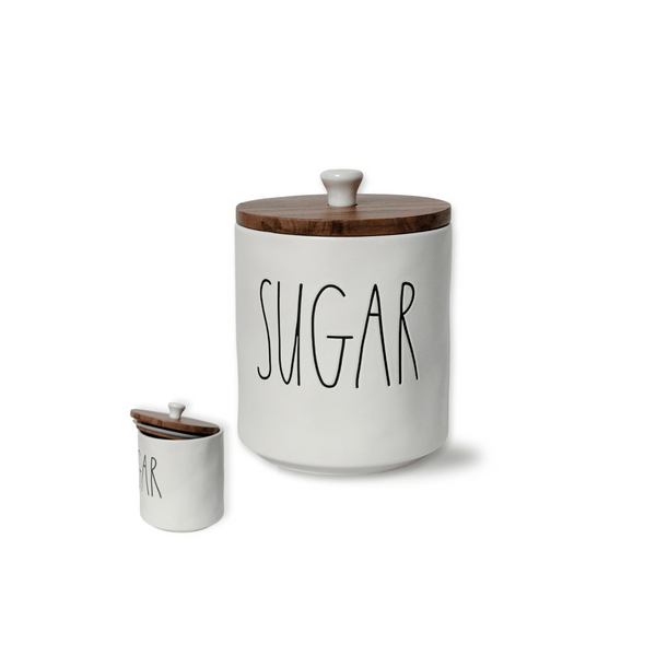 The newest style available to the Rae Dunn x Magenta artisan collection is this wider small "Sugar" Canister. &nbsp;Its farmhouse style with wood top and knob will add a touch of charm to any space. Ceramic Sugar Container