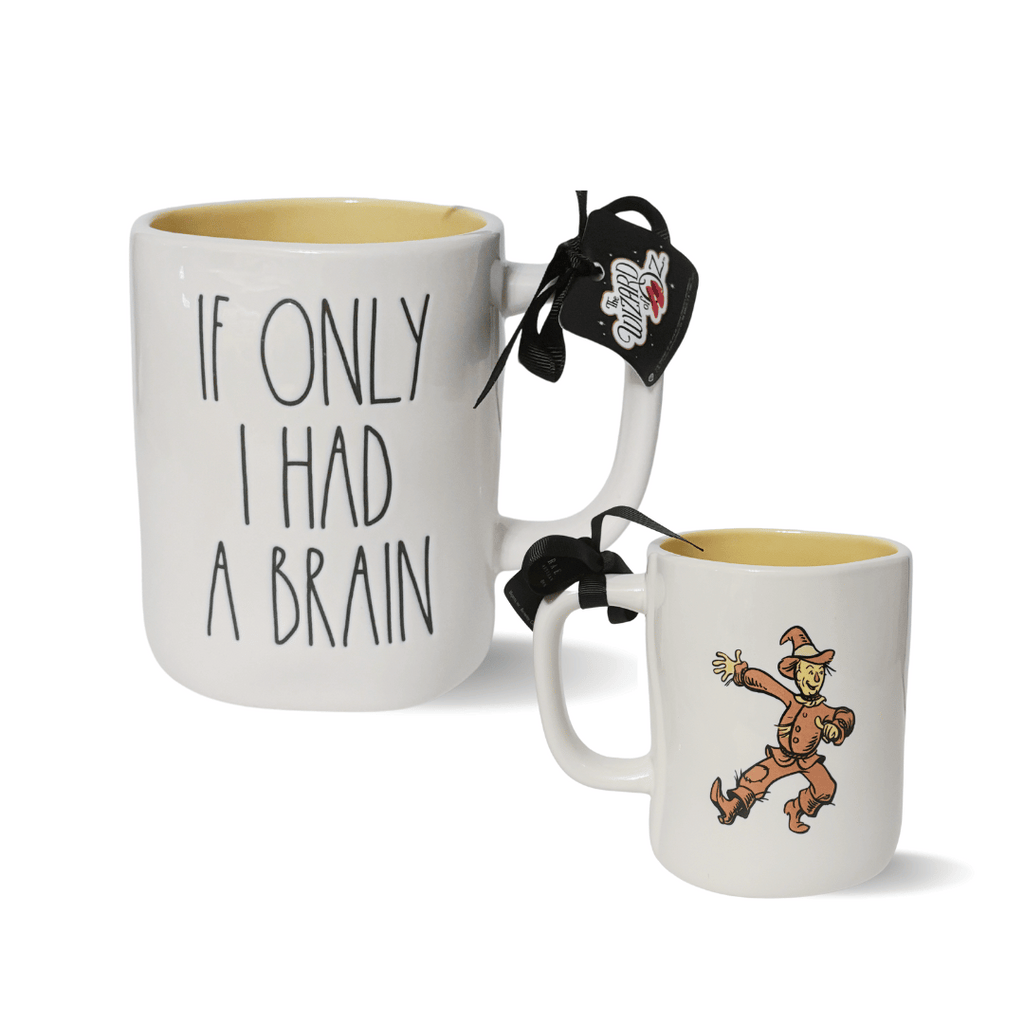 Rae Dunn’s Wizard of Oz™ Collaboration mugs. Each mug is made of quality stoneware and features a whimsical portrait of your favorite Wizard of Oz™ Characters.
The front features Rae Dunn’s classic Artisan hand lettering, while the back showcases beautiful artwork