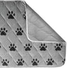 A gray puppy pad with a black paw print pattern, shown with one corner folded over to reveal a textured underside, on a white background.