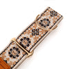 Dog collar with floral pattern and gold hardware on a white background